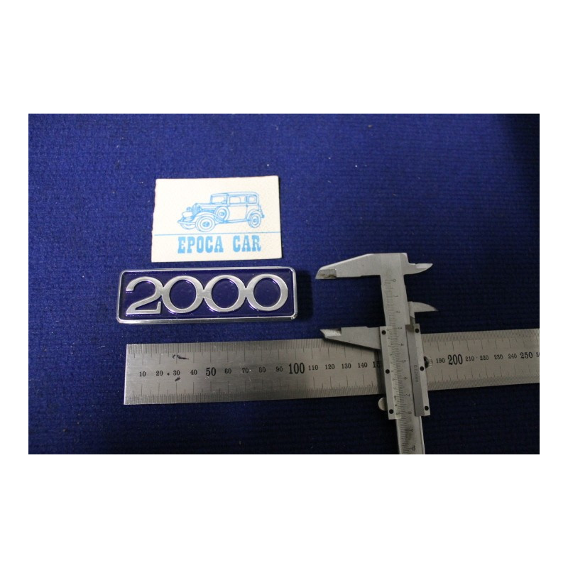 EMBLEM "2000"  METAL CHROME  BLUE BACKGROUND