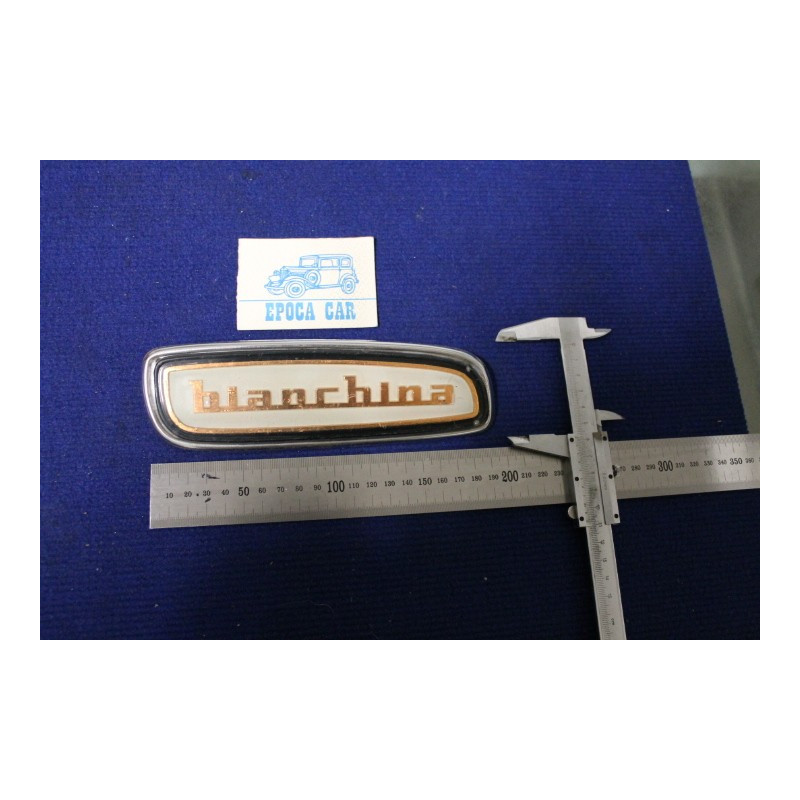SCRITTA "BIANCHINA" (COPRIRADIO) PLASTICA SU PLANCIA DI METALLO CROMATO